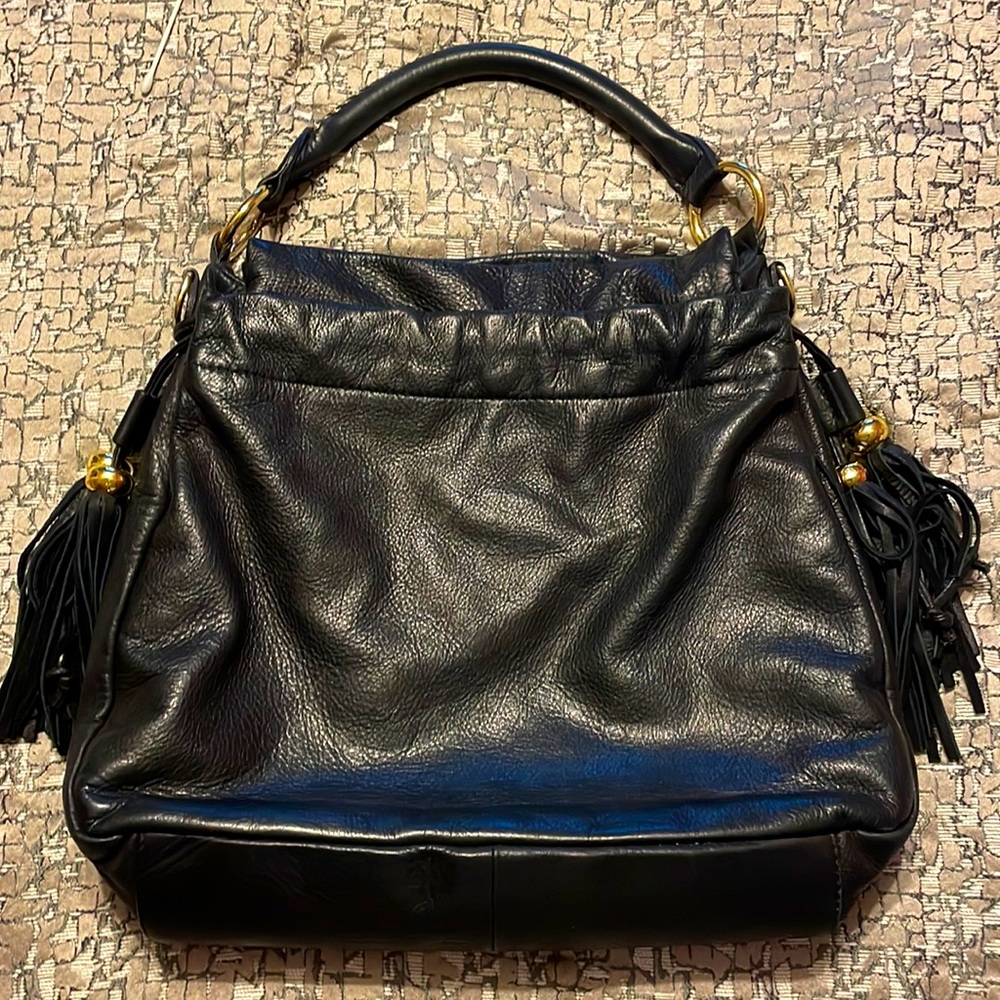 A leather black and gold purse. Very cute and spacious